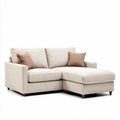 L-vormige bank in lichtbeige stof met kussens 230 x 150 x 90cm